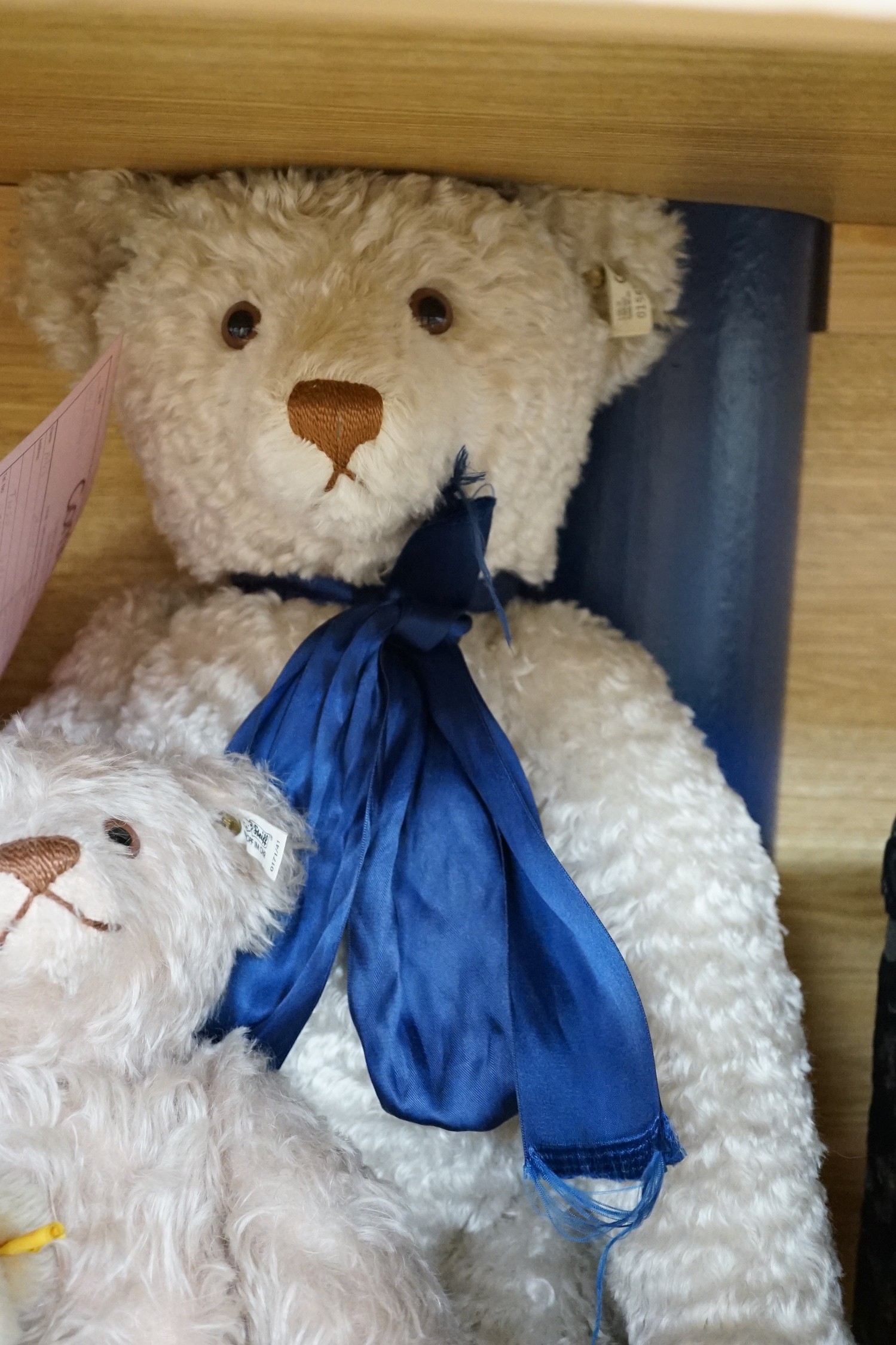 A large Steiff growler blonde plush teddy bear, 68cms long and four other Steiff teddy bears